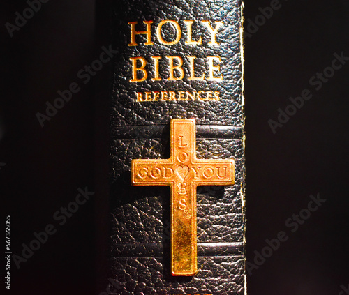 Holy Bible black with gold cross saying God Loves You