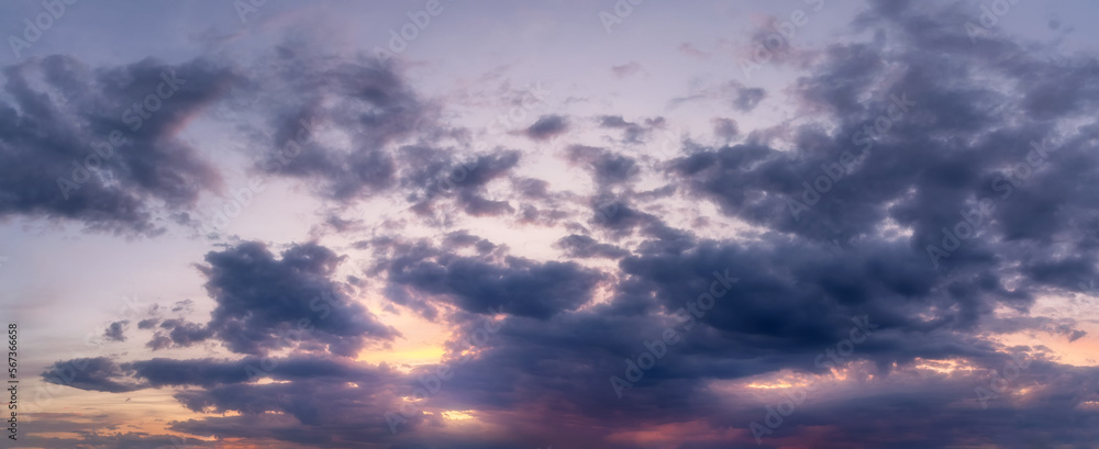 Sky with clouds during sunset or sunrise. Panoramic skyscape.