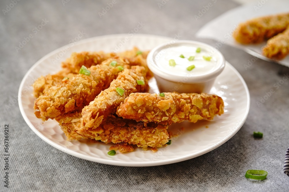 Potato chips breaded Chicken strips | Game day appetizers, selective focus Potato chips breaded Chicken strips | Game day appetizers, selective focus