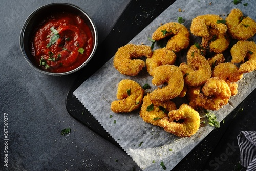 Homemade Popcorn shrimps breaded with cornmeal | Game day appetizer, selective focus