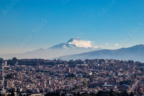 Cayambe volcano on a winter morning with clear sky. View of the sky with some clouds.