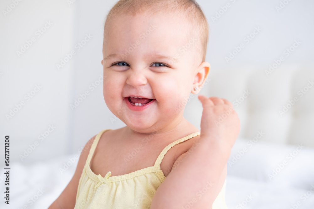portrait of cute baby girl smiling with first milk teeth. Healthy newborn child portrait of cute baby girl smiling with first milk teeth. Healthy newborn child
