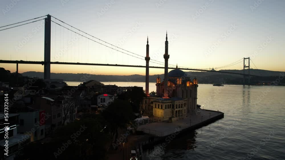 ORTAKOY, ISTANBUL, TURKEY. Aerial view of Istanbul. Ortakoy Mosque and Bosphorus Bridge (15th July Martyrs Bridge) sunrise view. Panoramic drone shot. ORTAKOY, ISTANBUL, TURKEY. Aerial view of Istanbul. Ortakoy Mosque and Bosphorus Bridge (15th July Martyrs Bridge) sunrise view. Panoramic drone shot.