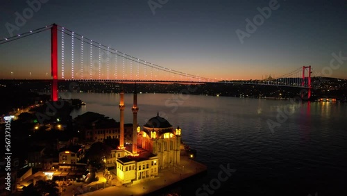 ORTAKOY, ISTANBUL, TURKEY. Aerial view of Istanbul. Ortakoy Mosque and Bosphorus Bridge (15th July Martyrs Bridge) sunrise view. Panoramic drone shot.