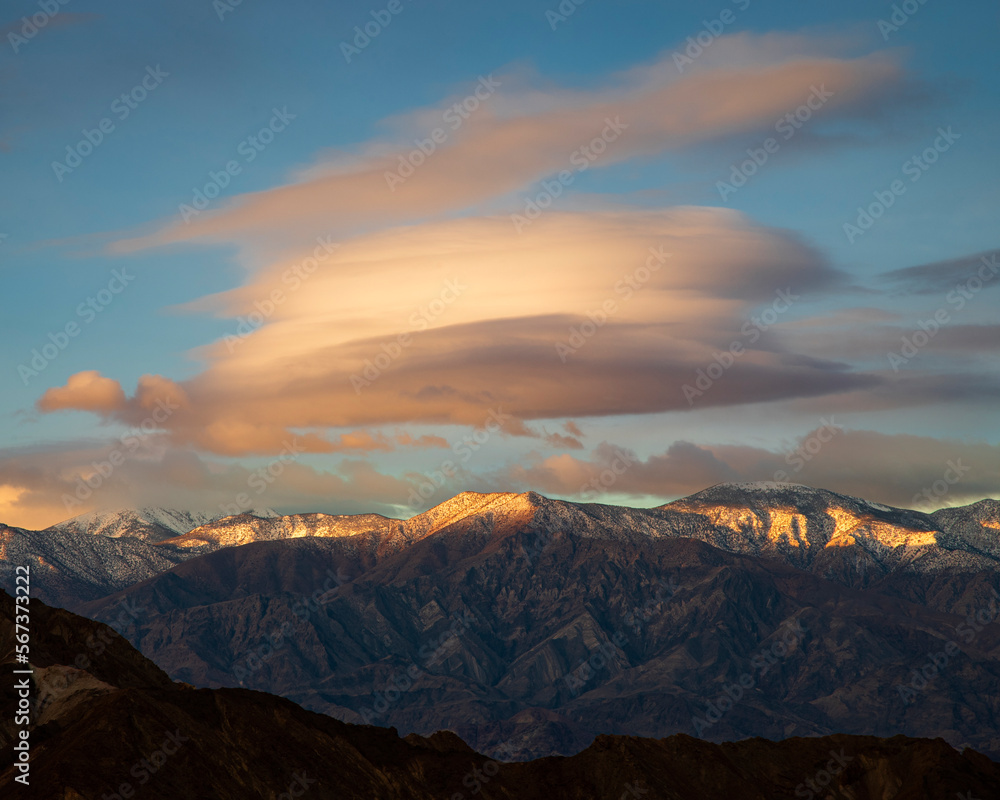 Lenticular cloud over the Panamint Mountain Range in Death Valley National Park - shot in golden morning light.