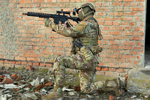 Infantry soldier shooting during military combat training.