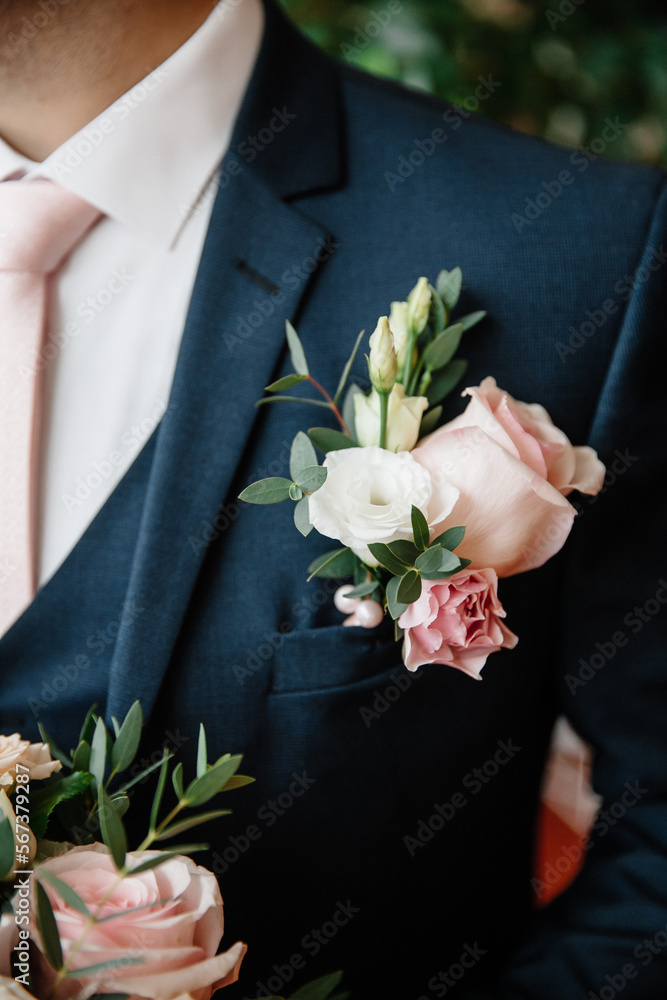 boutonniere close-up of the groom on his jacket boutonniere close-up of the groom on his jacket