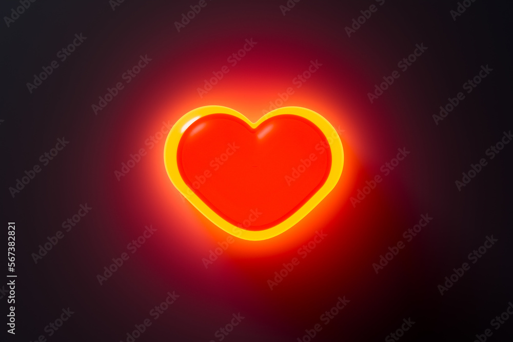 Neon heart on black wall