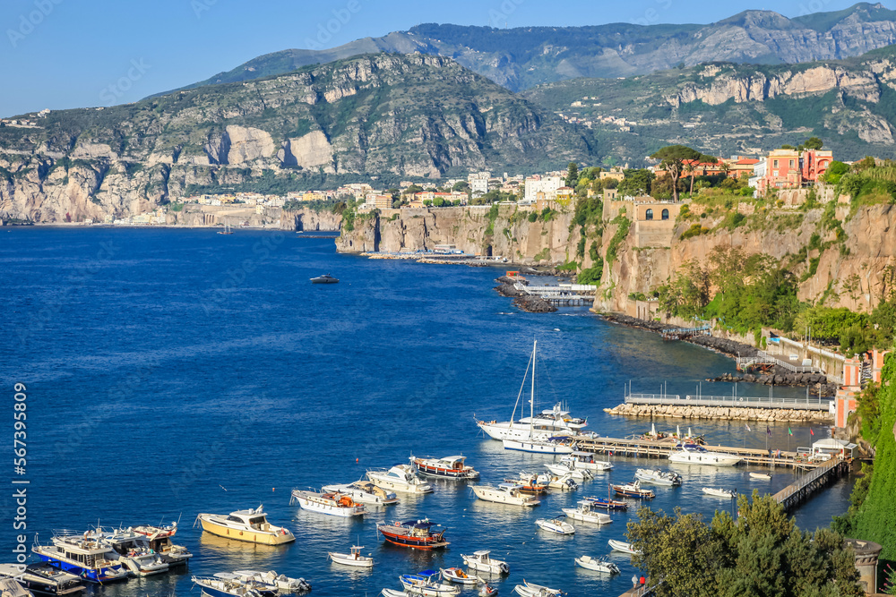 Sorrento city cliffs and marina with boats and yacht, amalfi coast, Italy