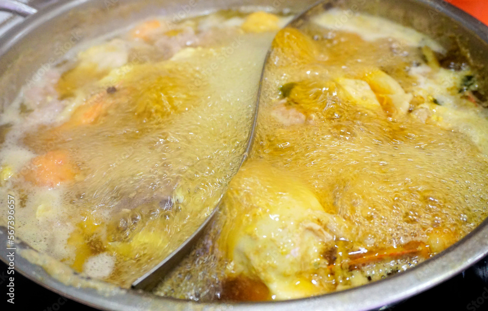 Boiled soup in hot pot, Close up shot Boiled soup in hot pot, Close up shot