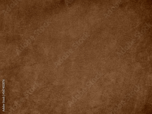 Brown color velvet fabric texture used as background. Empty brown fabric background of soft and smooth textile material. There is space for text..
