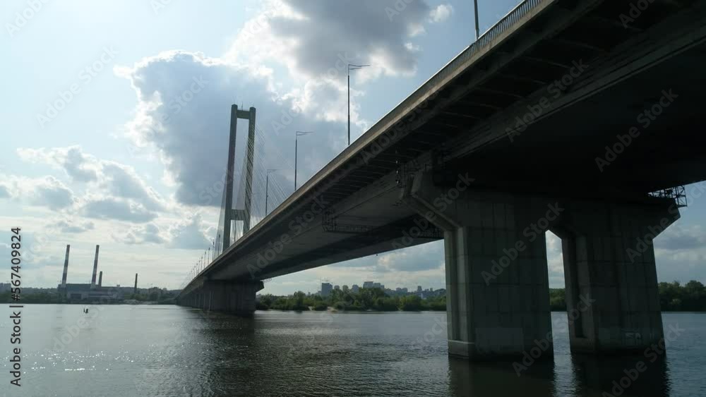 Aerial survey of the south bridge in Kyiv through the Dnieper. Ukraine. Summer. Warm morning. Aerial survey of the south bridge in Kyiv through the Dnieper. Ukraine. Summer. Warm morning.