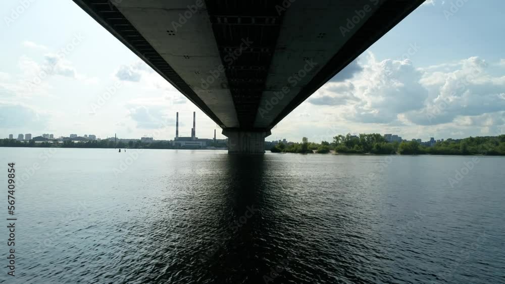 Aerial survey of the south bridge in Kyiv through the Dnieper. Ukraine. Summer. Warm morning. Aerial survey of the south bridge in Kyiv through the Dnieper. Ukraine. Summer. Warm morning.