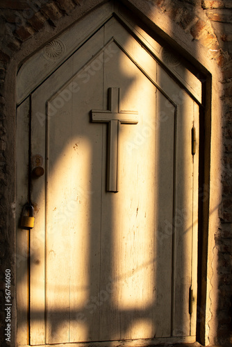 Door with a cross with rays of sunlight, Tbilisi, Georgia