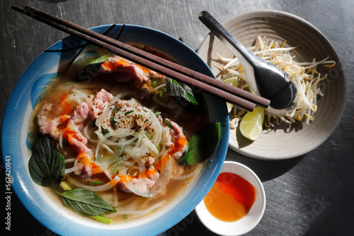 Bowl of Vietnamese traditional pho chicken noodle soup in a street restaurant, Tan Chau, Vietnam, Indochina, Southeast Asia, Asia photo