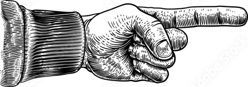A hand pointing a finger in a direction sign. In a vintage antique engraving woodblock or woodcut style.
