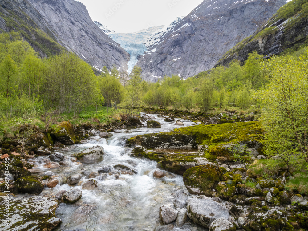 Stream from the melting of the Briksdal glacier, one of the best known arms of the Jostedalsbreen glacier, Vestland, Norway, Scandinavia, Europe Stream from the melting of the Briksdal glacier, one of the best known arms of the Jostedalsbreen glacier, Vestland, Norway, Scandinavia, Europe