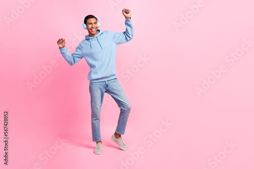 Full length photo of cheerful nice man eyes closed wear blue stylish clothes have fun chill empty space isolated on pink color background