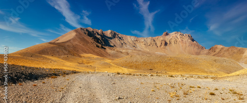 Amazing panoramic landscape of Mount Erciyes. View of the an inactive volcano  mountain range  stony slopes  rocky peaks formed by lava flows. Kayseri Province  Turkey.