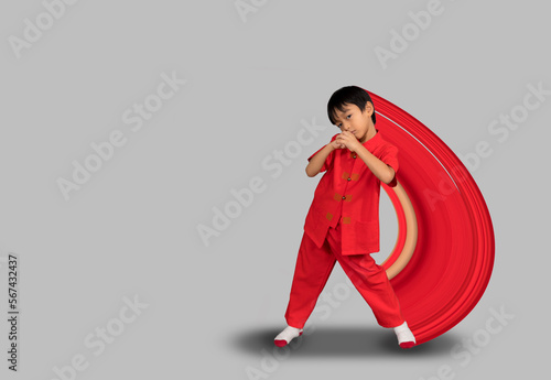 lPixel Stretch Effect  ittle boy fashion Smiling child in red chinese dress, style and fashion ideas for children. photo