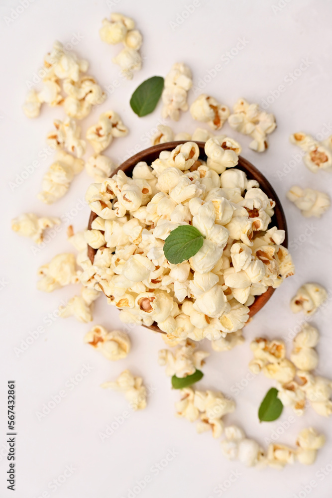 closeup the bunch white yellow popcorn with green mint leaves isolated on white background. closeup the bunch white yellow popcorn with green mint leaves isolated on white background.