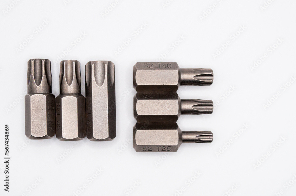 torx bits set isolated on white background. Closeup of steel star screwdrivers kit torx bits set isolated on white background. Closeup of steel star screwdrivers kit