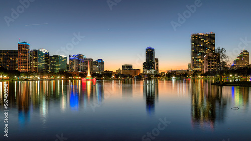 Orlando city skyline at sunset in Lake Eola Park with fountain  Florida  USA