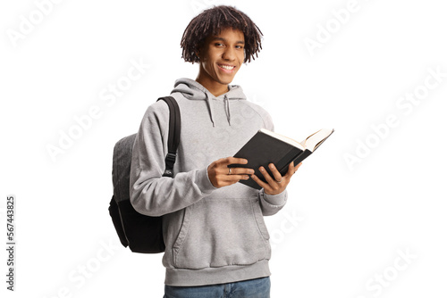 Male african american student standing and reading a book