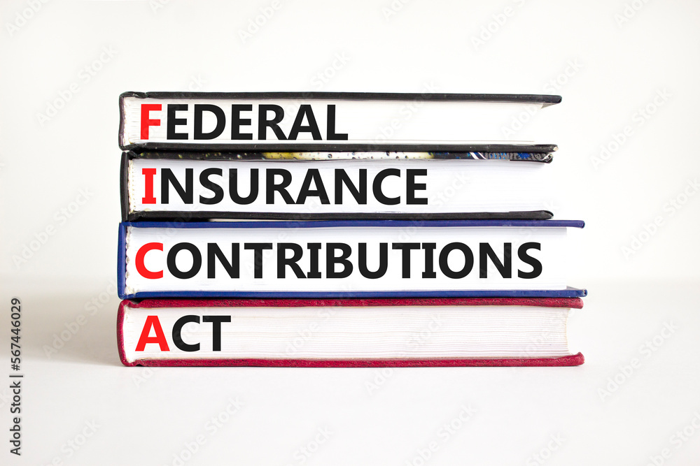 FICA symbol. Concept words FICA federal insurance contributions act on books on beautiful white table white background. Business FICA federal insurance contributions act concept. Copy space. FICA symbol. Concept words FICA federal insurance contributions act on books on beautiful white table white background. Business FICA federal insurance contributions act concept. Copy space.