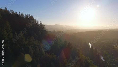 Sunrise Over Forested Mountain Near Del Rio Woods Regional Park In Healdsburg, California. aerial ascend photo