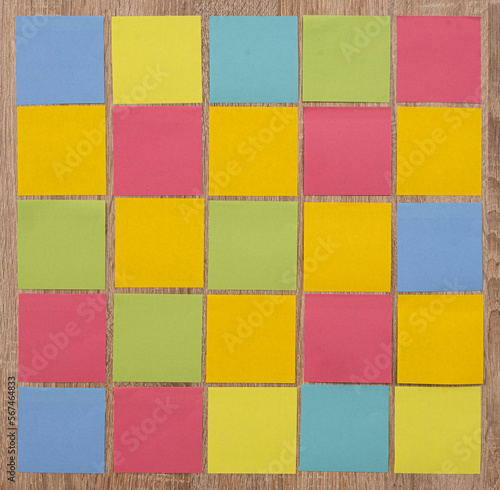 empty colorful post it on wooden background