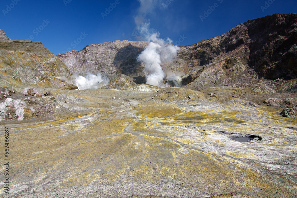 Lots of activity in the crater of Whakaari, White Island volcano in new Zealand with steam and boiling toxic water in the crater lake