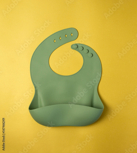 Silicone bib for babies. Baby feeding and nutrition concept. Top view, flat lay.