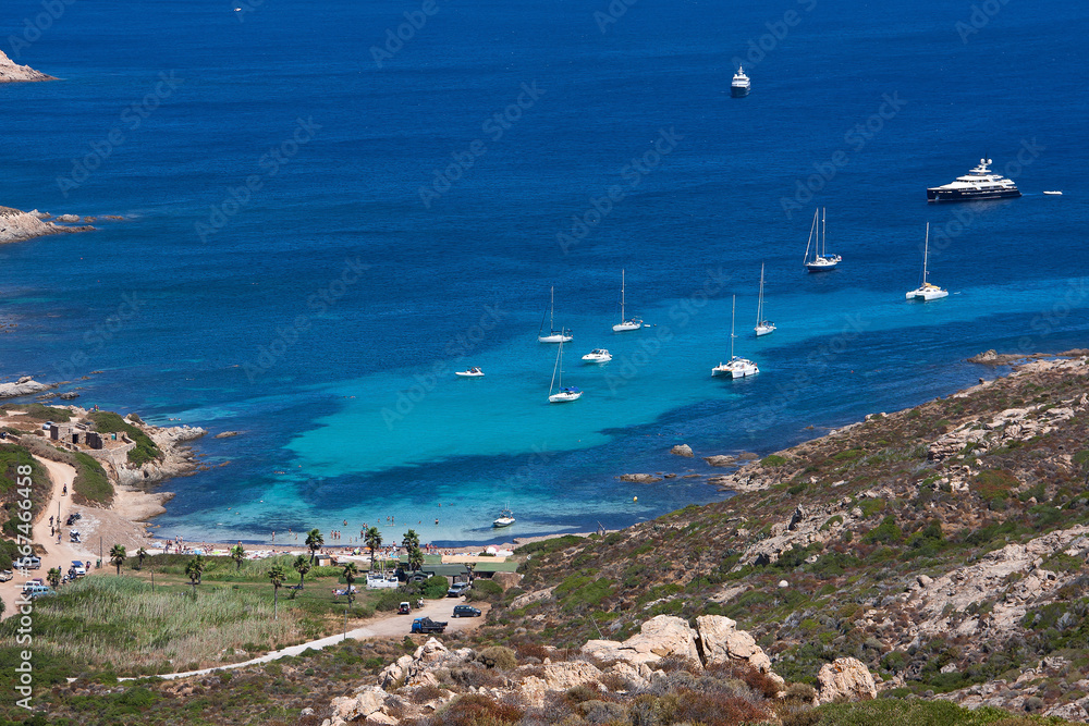 Obraz premium Tropical bay with sailing boats at the french island Corsica in the mediterranean sea