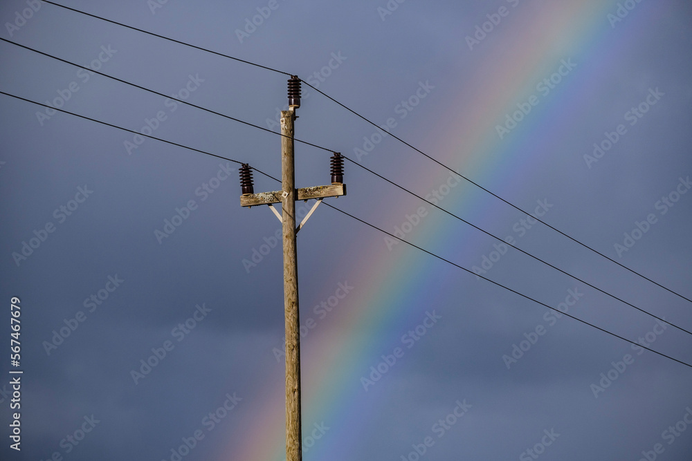 old electric pole with the rainbow behind, Majorca, Balearic Islands, Spain old electric pole with the rainbow behind, Majorca, Balearic Islands, Spain