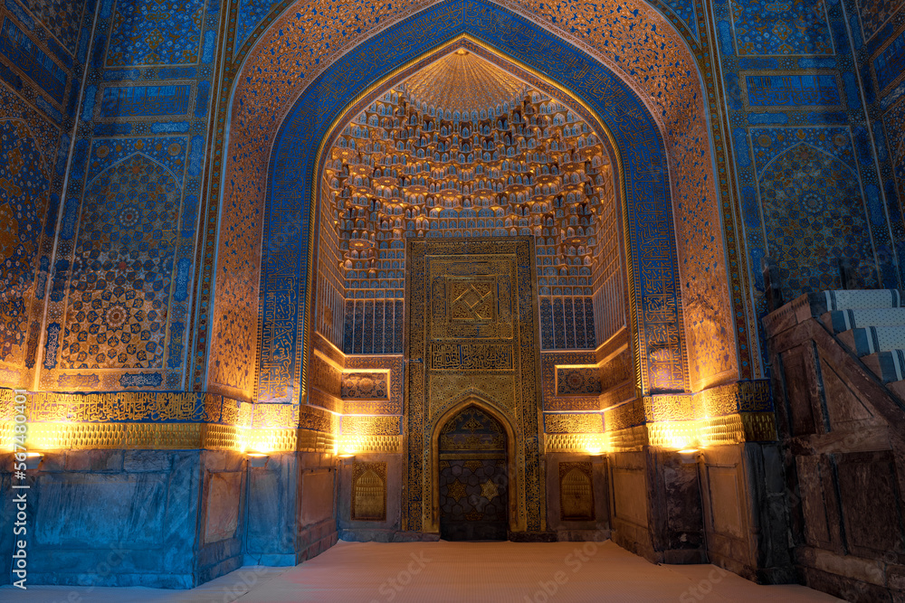 Mihrab - a niche indicating the direction to Mecca. The interior of the old mosque of the Tillya-Kari Madrasah, Samarkand. Uzbekistan