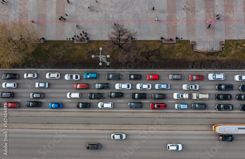 aerial drone flight top down view of freeway busy city rush hour heavy traffic jam highway. Aerial view of the vehicular intersection, traffic at peak hour with cars on the road,