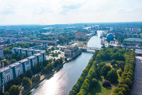 View of city center with canals Kaliningrad, central part with town hall, a beautiful park and embankment and a bridge view from a drone