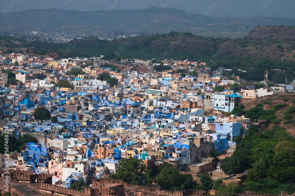 Top view of Jodhpur city as seen from famous Mehrangarh fort, Jodhpur, Rajasthan, India. Blue sky in the background. Mehrangarh Fort is UNESCO world heritage site popular amongst tourists worldwide.
