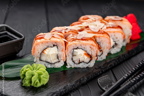 Sushi rolls with grilled salmon and pear.
