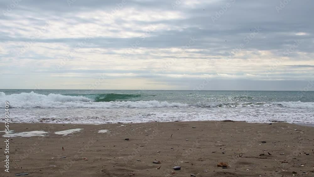 Waves at the seashore on a cloudy day Waves at the seashore on a cloudy day