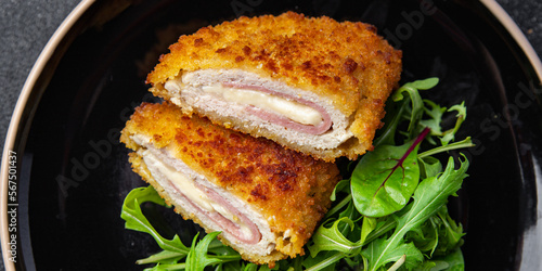 cordon bleu cutlet chicken meat, cheese, bacon meal snack on the table copy space food background rustic top view photo