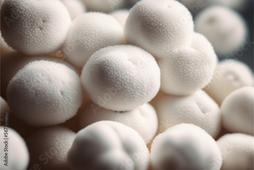  a pile of white balls sitting on top of each other in a bowl of white foam balls with a black border around the top of the balls.  generative ai