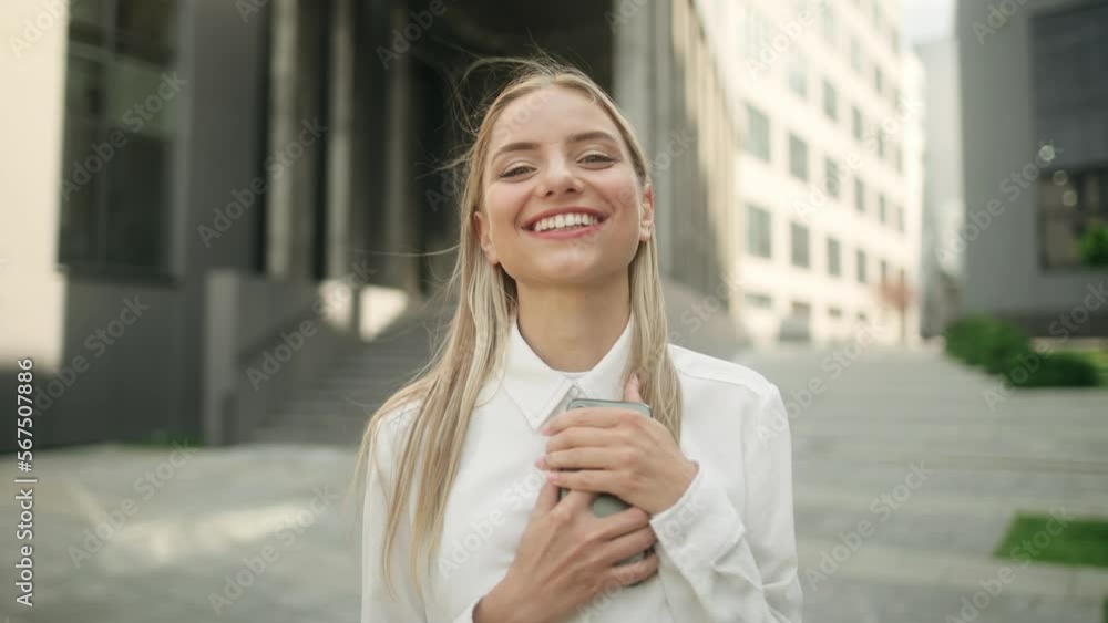 Closeup joyful girl reading good news on phone in slow motion. Portrait of happy business woman enjoy success on mobile phone. Surprised lady celebrating victory on phone Closeup joyful girl reading good news on phone in slow motion. Portrait of happy business woman enjoy success on mobile phone. Surprised lady celebrating victory on phone