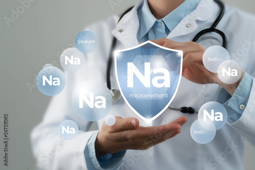 Immunity protection concept. Shield in doctor`s hands with Na, Sodium icon, manganese.