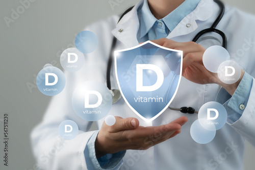  Immunity protection concept, vitamin D. Shield in doctor`s hands with Vitamin D.