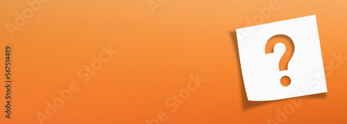 Note paper with question mark on panoramic orange background	
