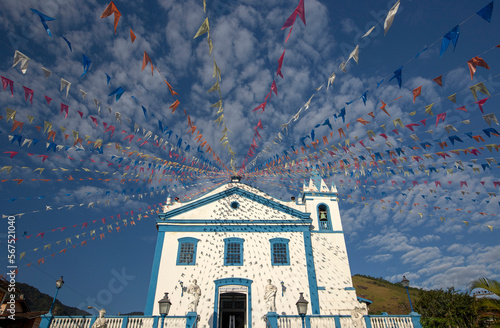 Church of Our Lady of Help, or Nossa Senhora d Ajuda in portuguese, decorated with June festival flags. Ilhabela, colonial town on the coast of Sao Paulo state, Brazil photo