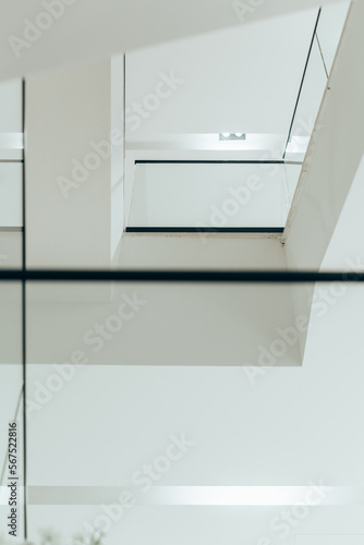 white interior with glass fence and stairs