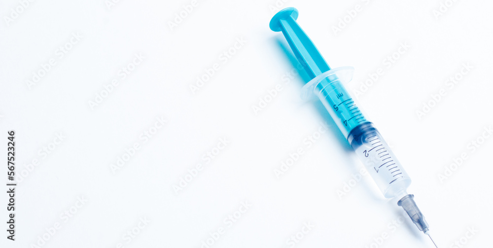 Medical syringe on a white background. A syringe for injection. The concept of health and beauty Medical syringe on a white background. A syringe for injection. The concept of health and beauty